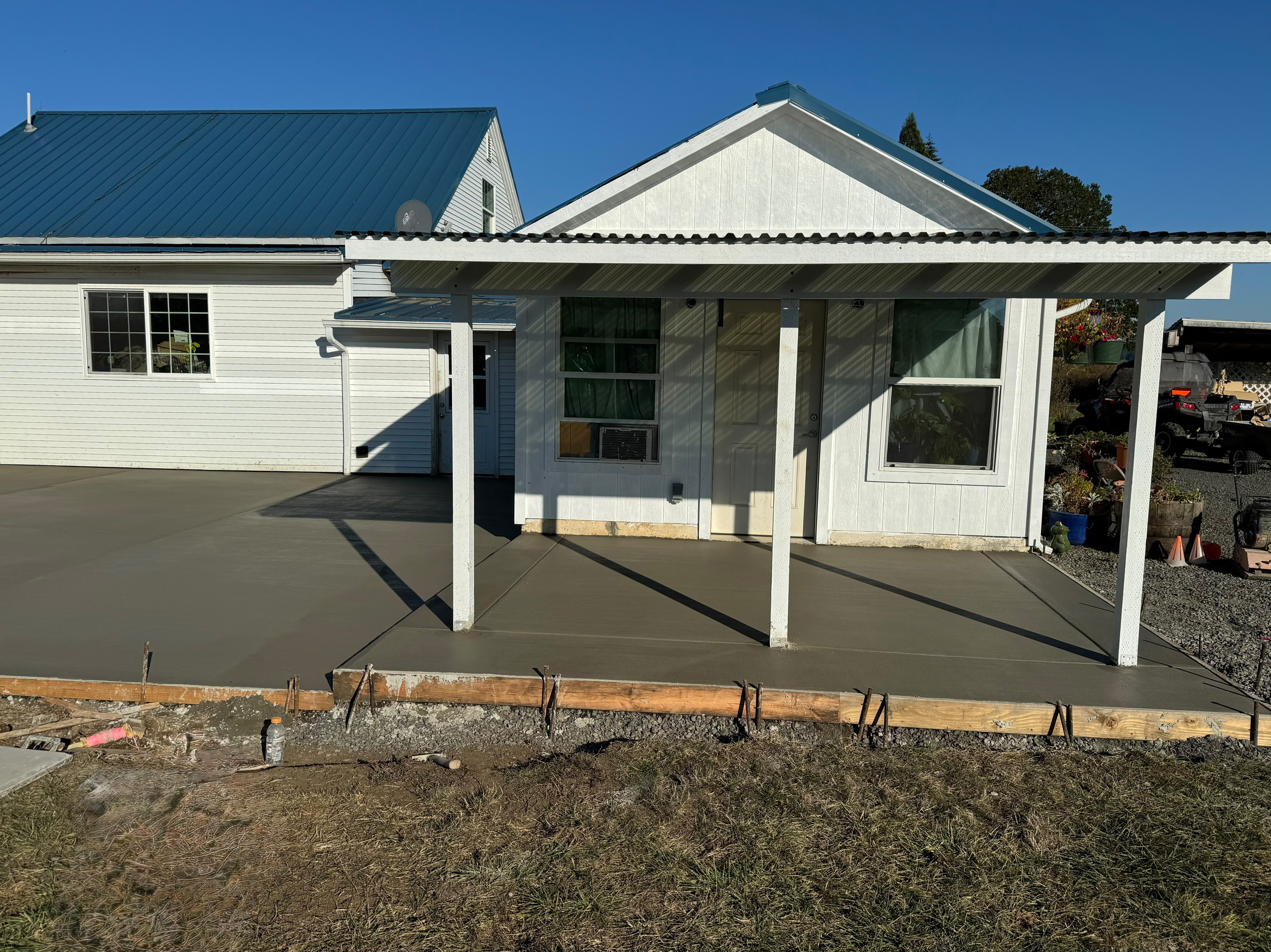residential covered patio concrete slab extension and porch pad completed by Foothills Concrete LLC in Oregon