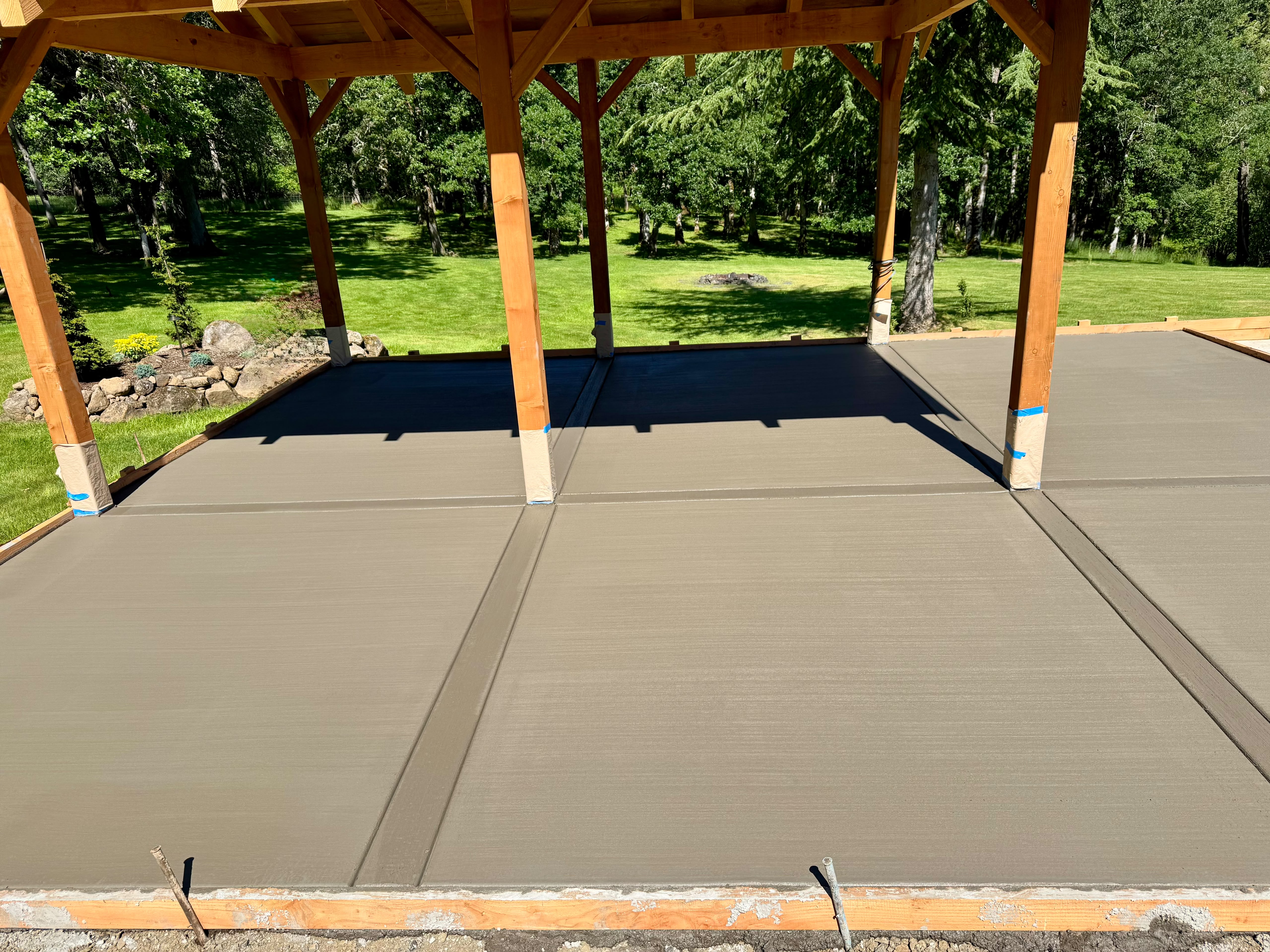 custom cedar pavilion timber gazebo concrete patio slab with picture-frame borders in Silverton Oregon by Foothills Concrete LLC