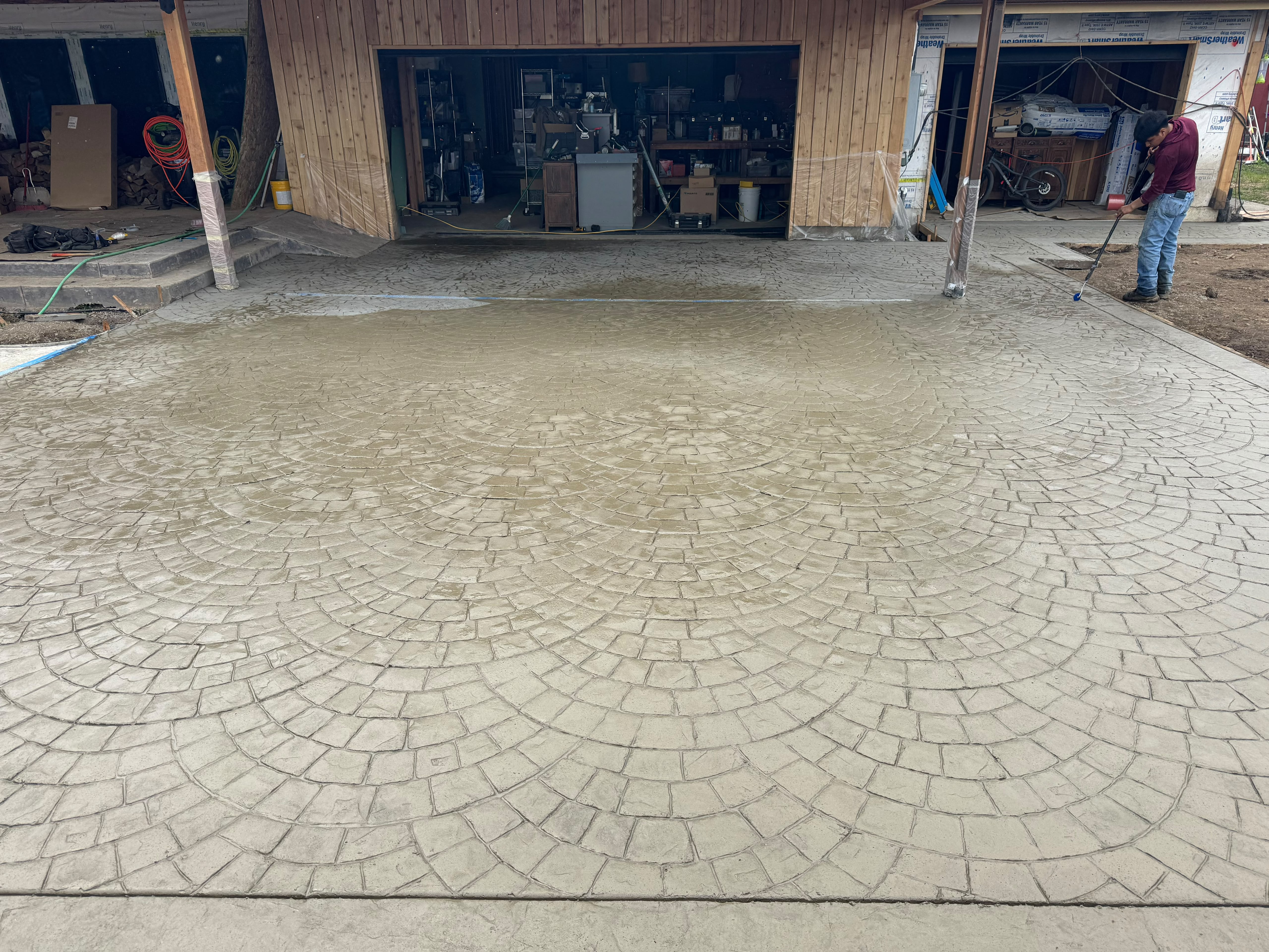 decorative european fan cobblestone stamped concrete driveway apron and approach in Salem Oregon by Foothills Concrete LLC