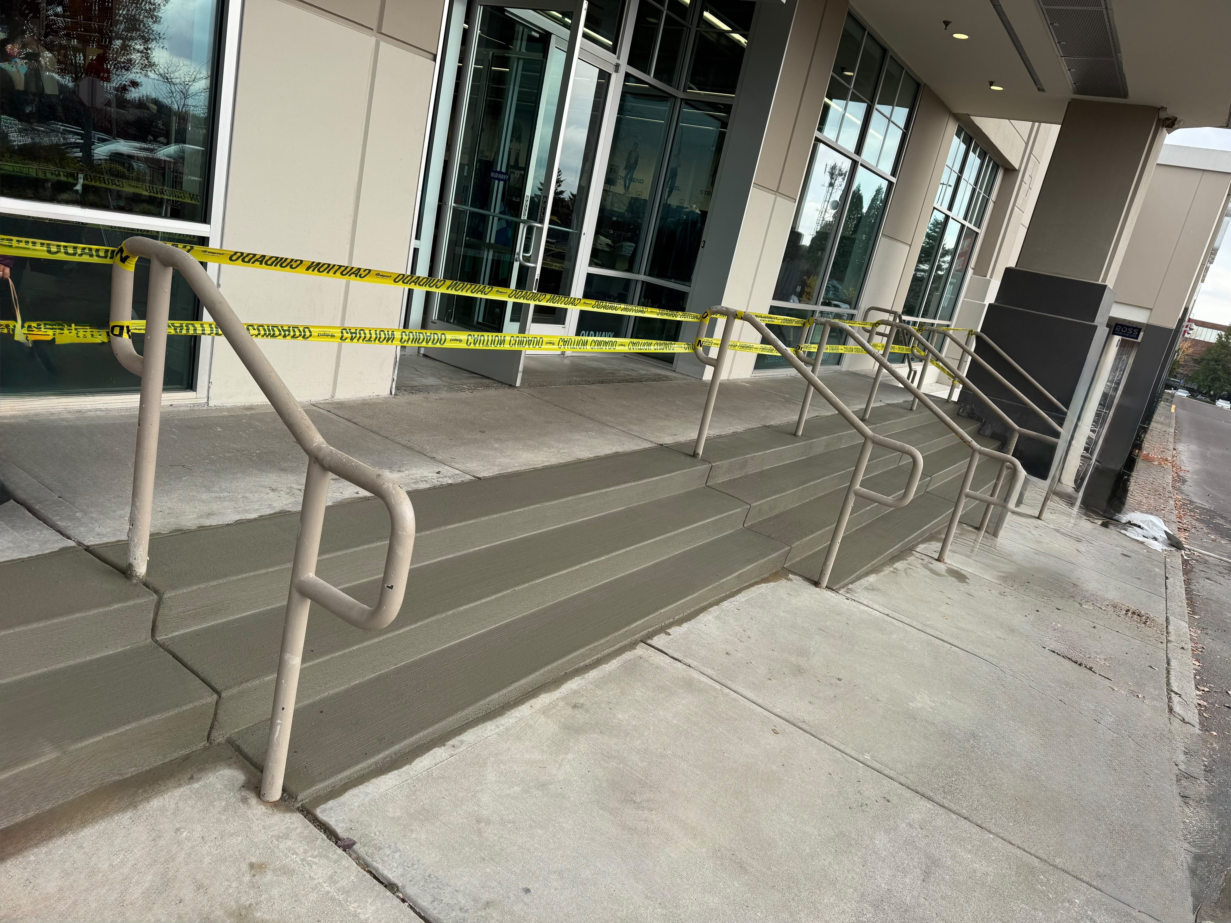 commercial retail store concrete entry steps with safety handrails poured in Keizer Oregon by Foothills Concrete LLC