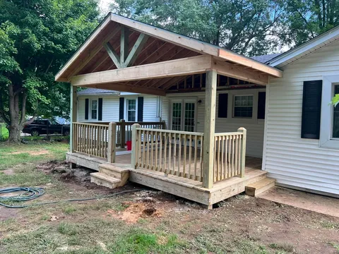 Covered back porch with a vaulted tongue-and-groove pine ceiling