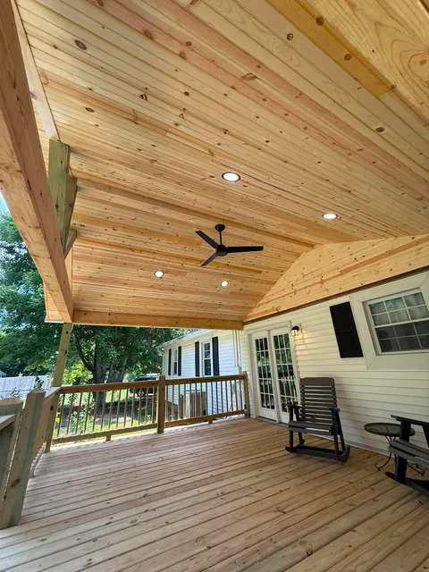 Wood deck built around an above-ground pool