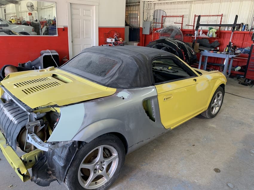 Vehicle front-end hood and grille assembly realignment