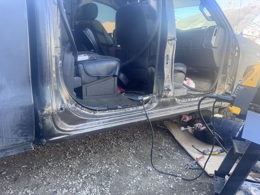 Technician testing electronic control modules and sensors