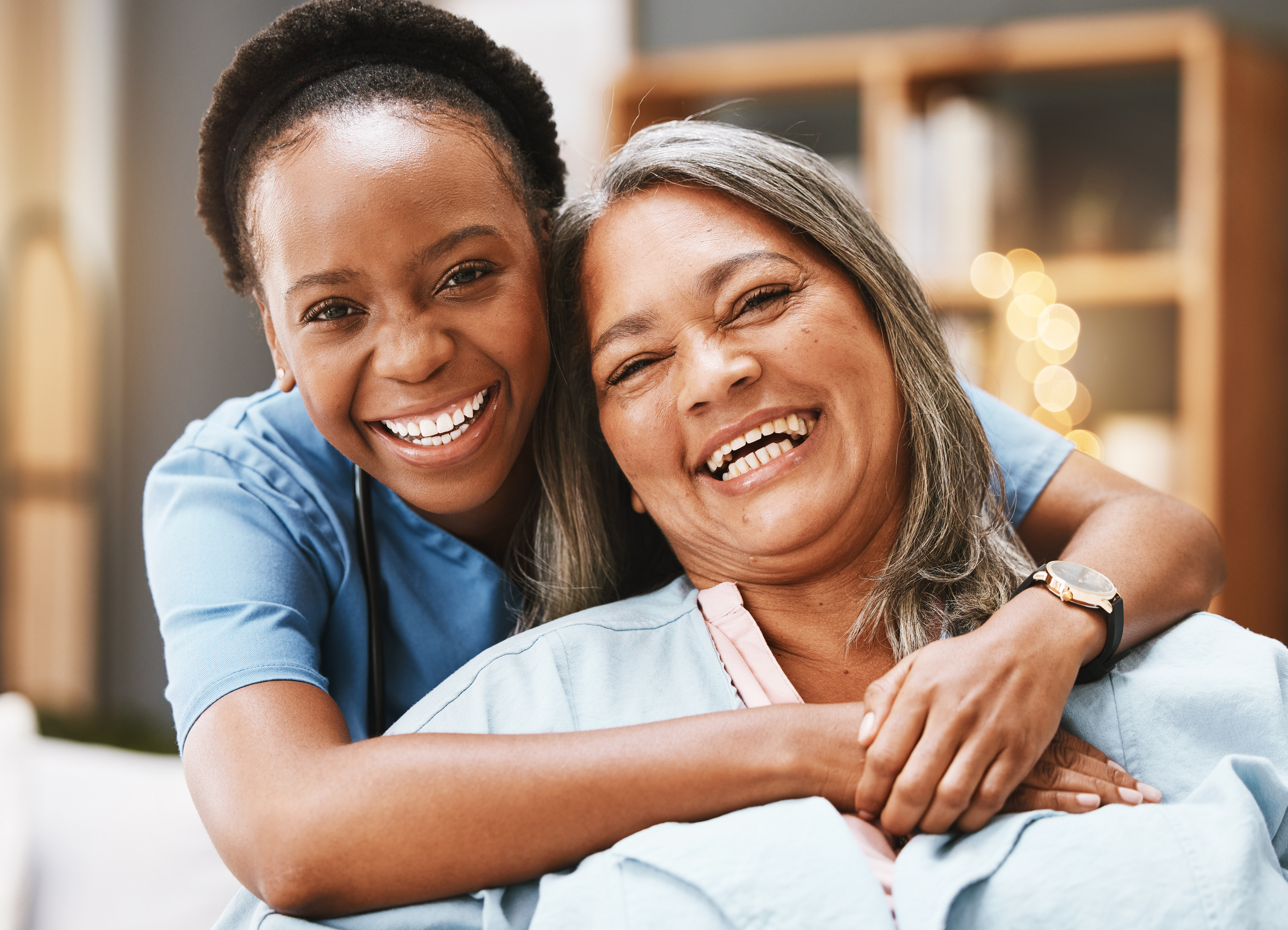 Compassionate healthcare staff and smiling resident at Arcadia Care Center