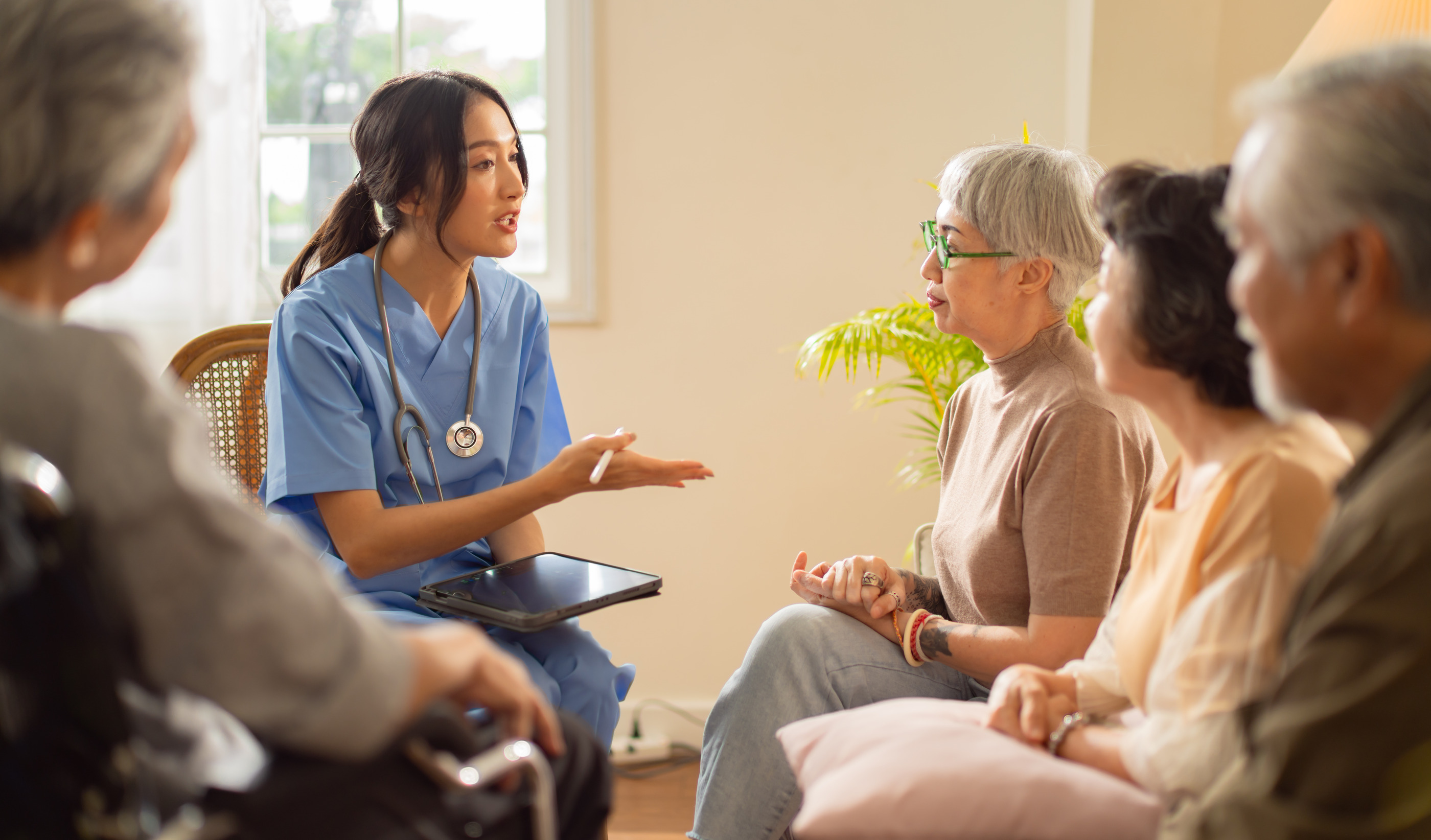 Arcadia Care Center nurse consulting with residents and families