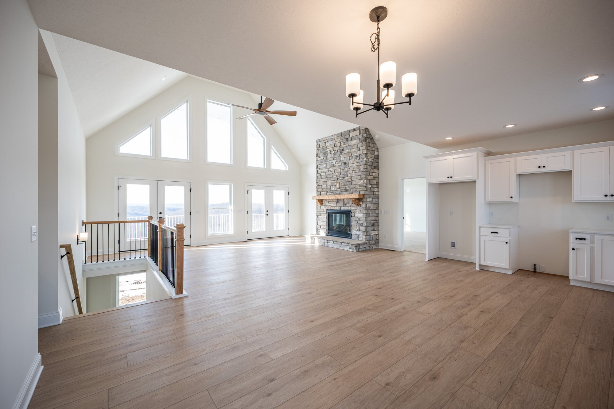 Vaulted living room with fireplace interior photography