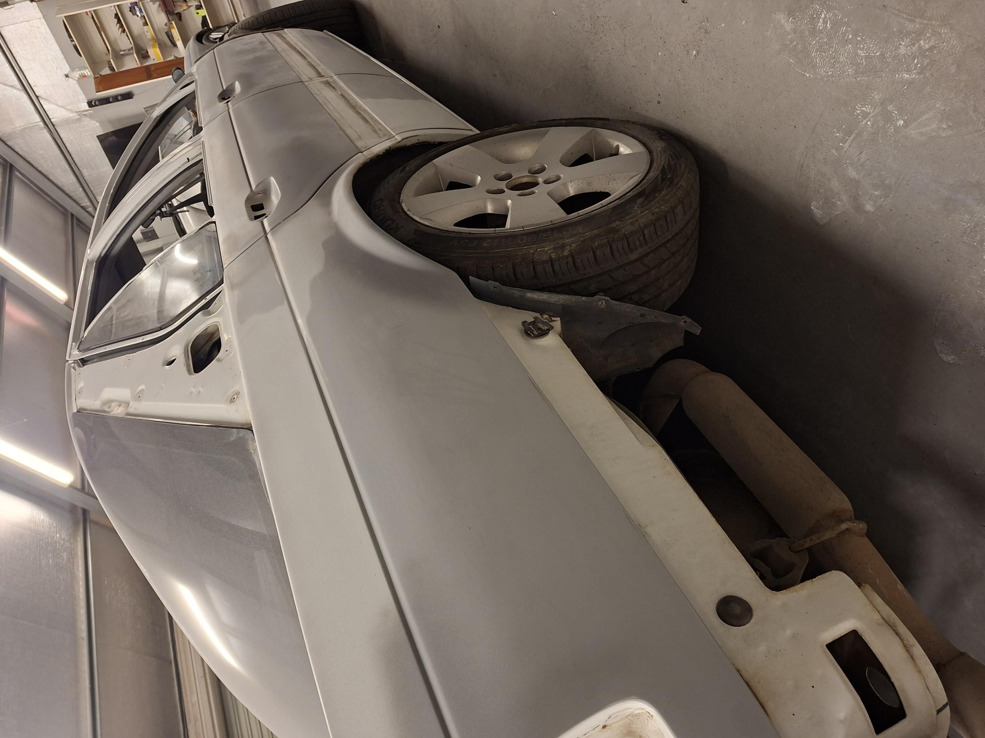 Close-up perspective of rear quarter panel wheel arch contour block-sanded smooth prior to booth respray at D&T Autobody Horsham Victoria