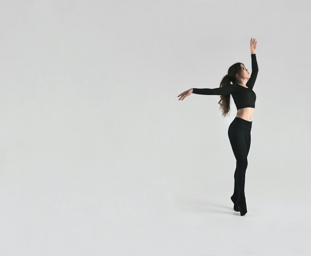 Dancer in motion against a studio backdrop