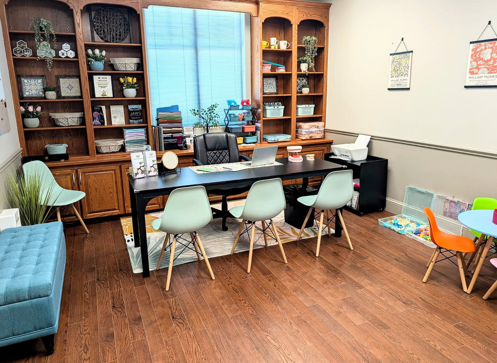 Atlantic Facial Myotherapy clinic space in Halifax, featuring consultation desk, child-friendly learning table, and educational tools