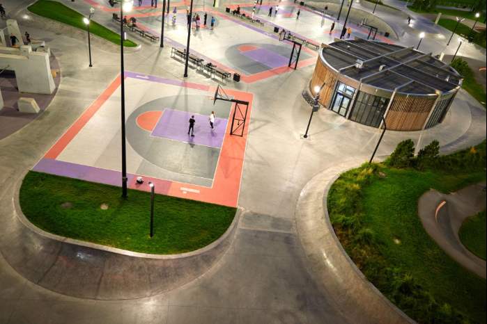 Aerial view of a colorful outdoor basketball court in a landscaped park during a court builder service in Henderson, NV