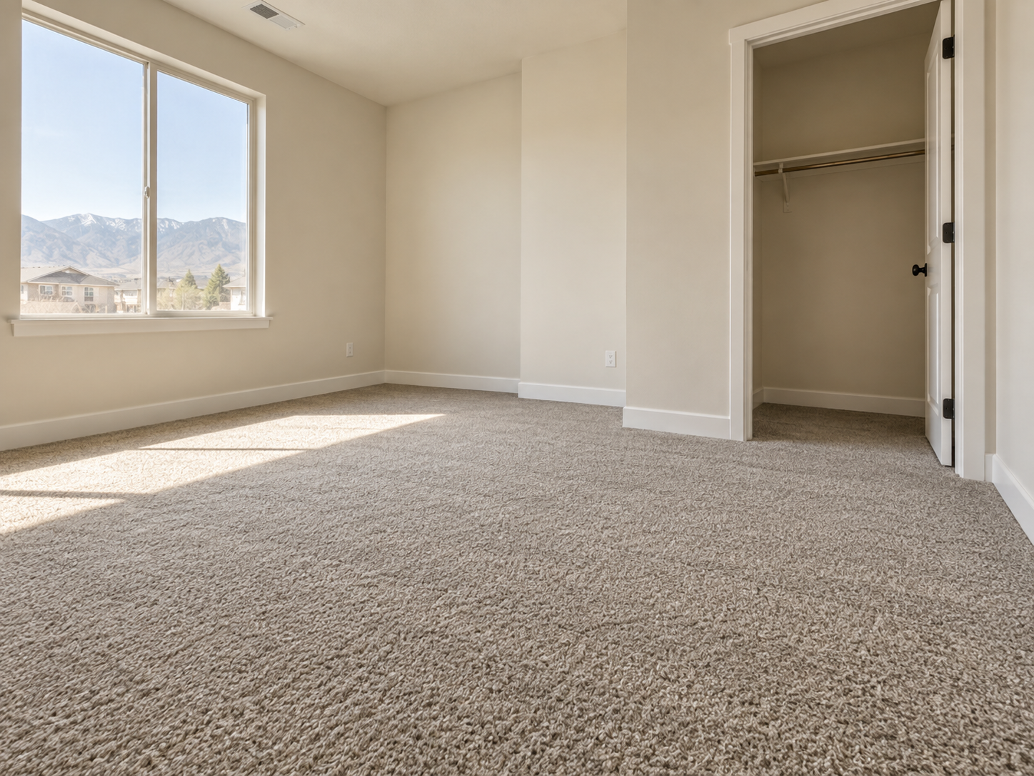Illustrative photo of clean neutral wall-to-wall bedroom carpet installation