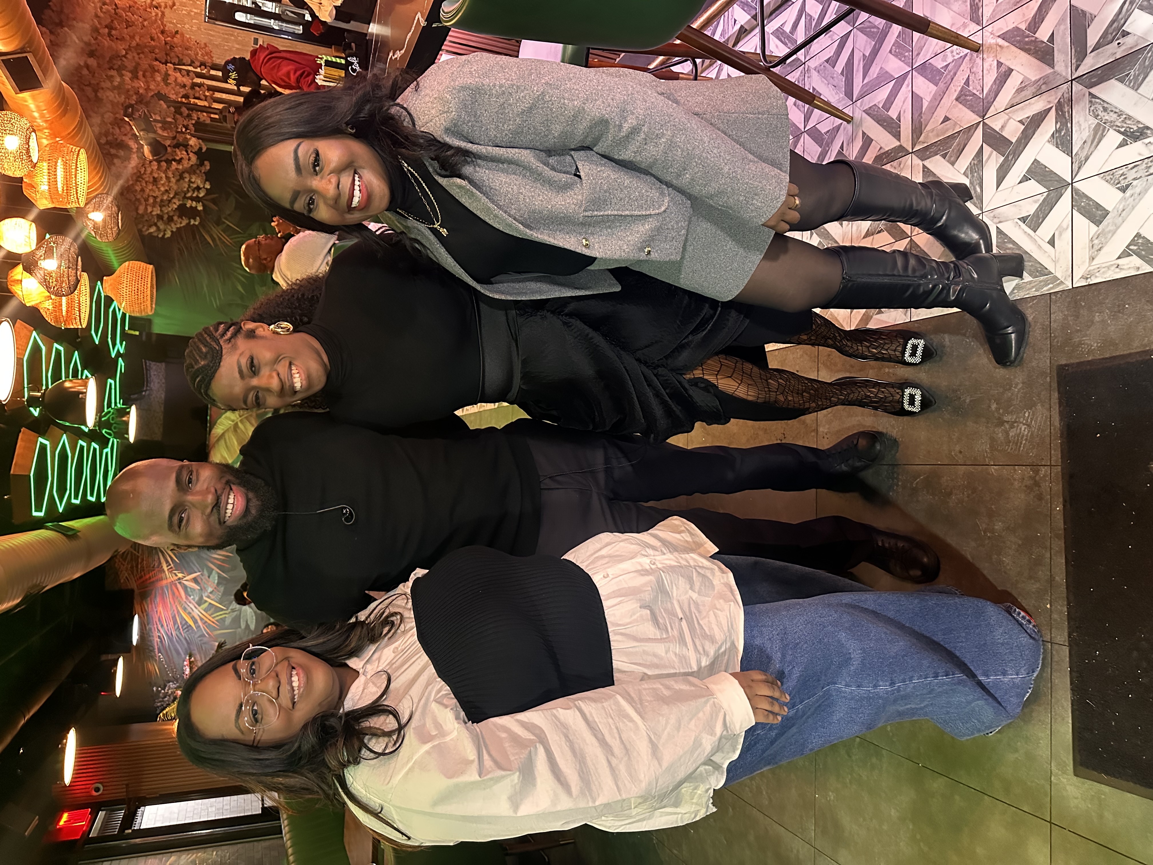 Attendees smiling together in fellowship at the brunch venue