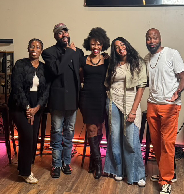 Speakers and hosts smiling together at The After Church Brunch