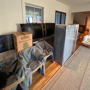 Elite Haulerz moving blanket wrap protecting furniture and headboard during interstate move