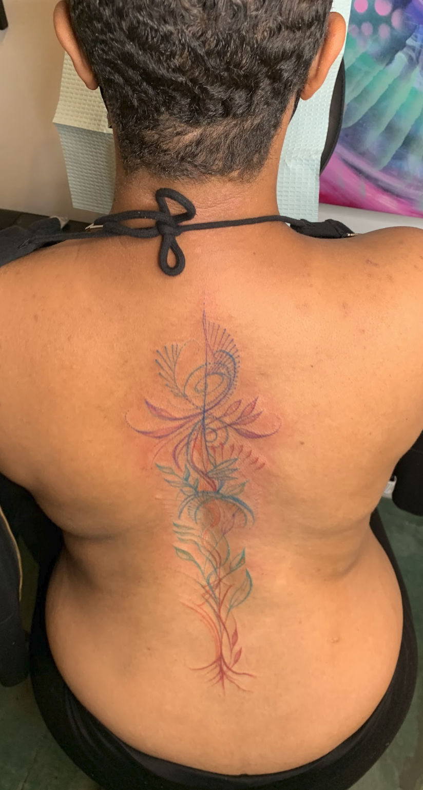 Vibrational Spine Alignment & Color Energy Mark Tattoo by Justine Almaraz