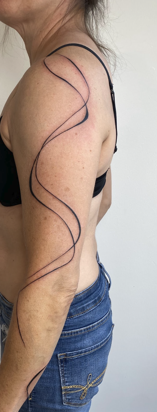 Continuous Dual Ribbon Contoured Flow Arm Tattoo by Justine Almaraz