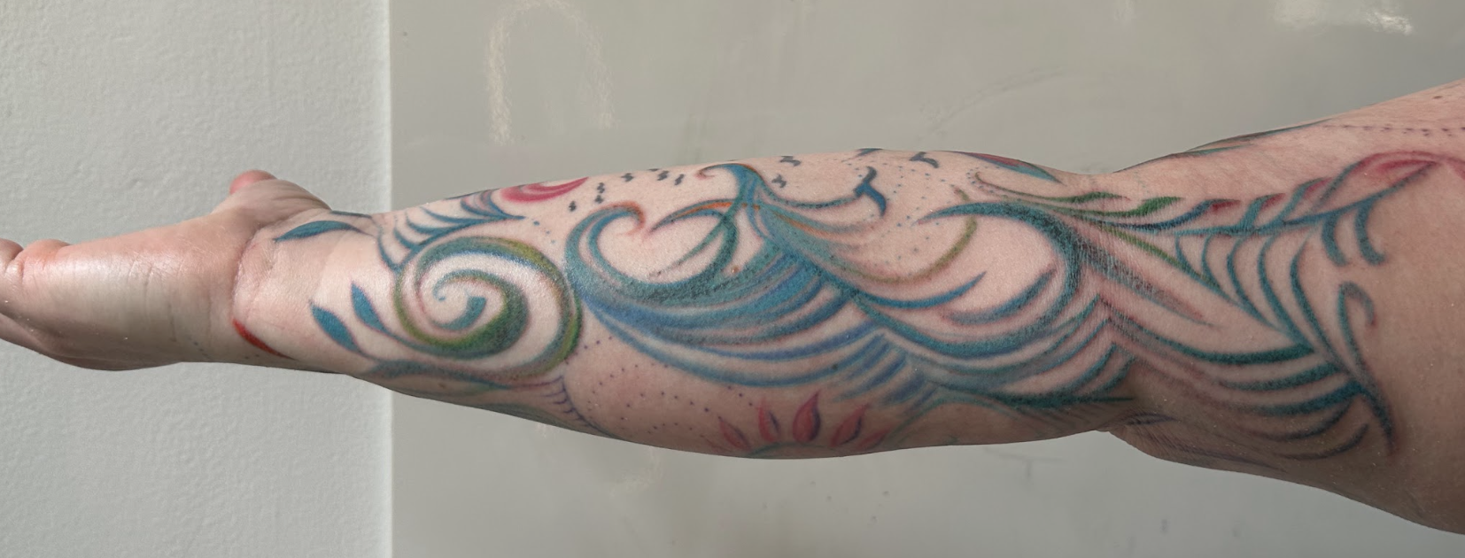 Vibrational Ocean Waves & Sacred Celestial Forearm Tattoo by Justine Almaraz