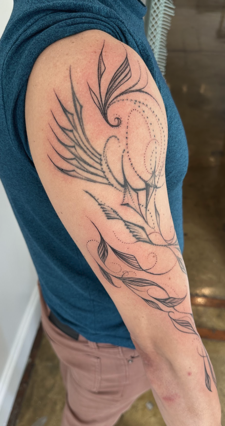 Sacred Upper Arm Wing & Resonant Dotwork Tattoo by Justine Almaraz