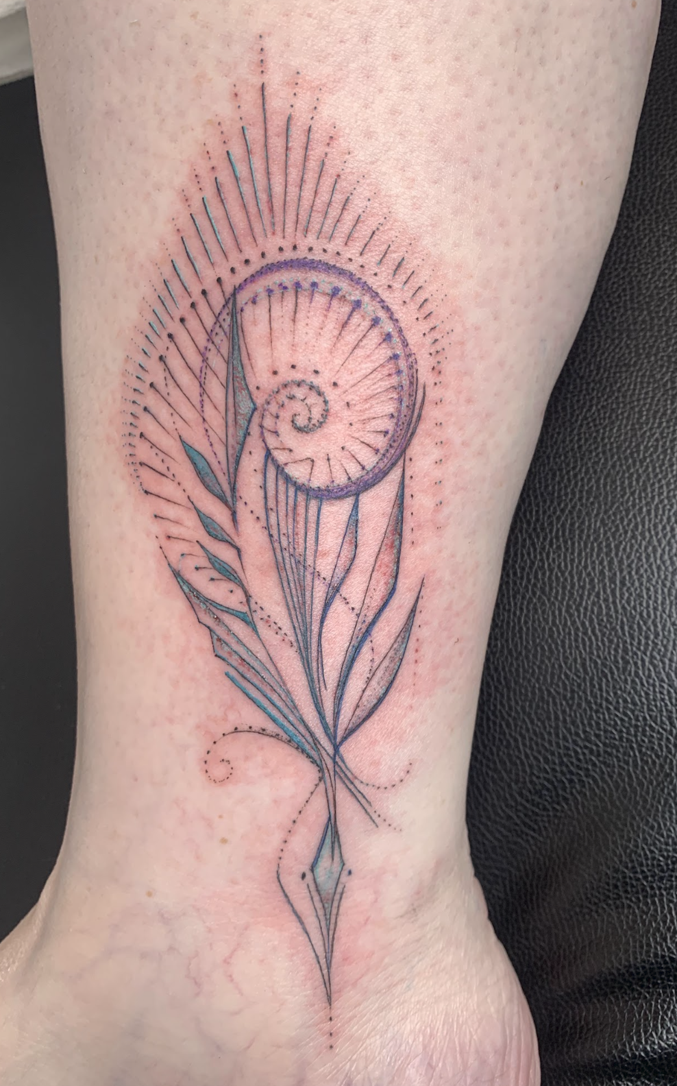 Sacred Nautilus Spiral & Botanical Ankle Tattoo by Justine Almaraz