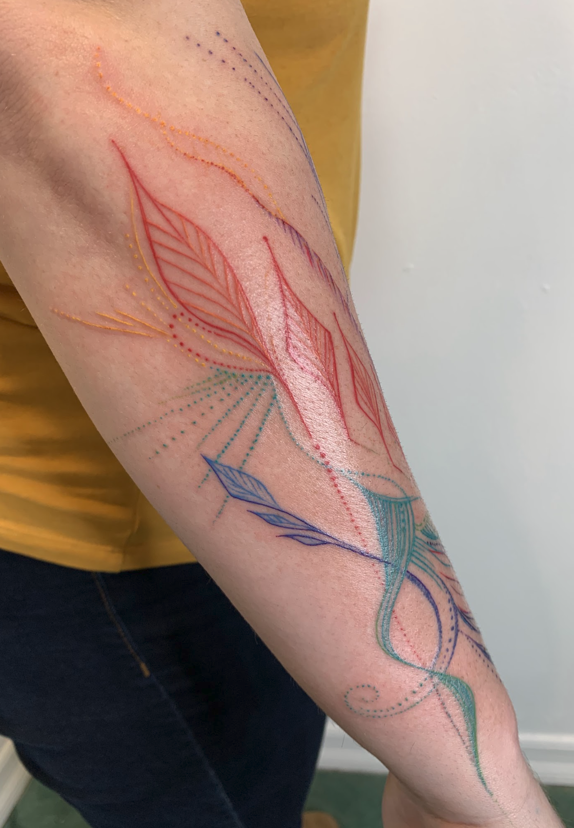Spectral Rainbow Energy & Botanical Fine-Line Forearm Tattoo by Justine Almaraz