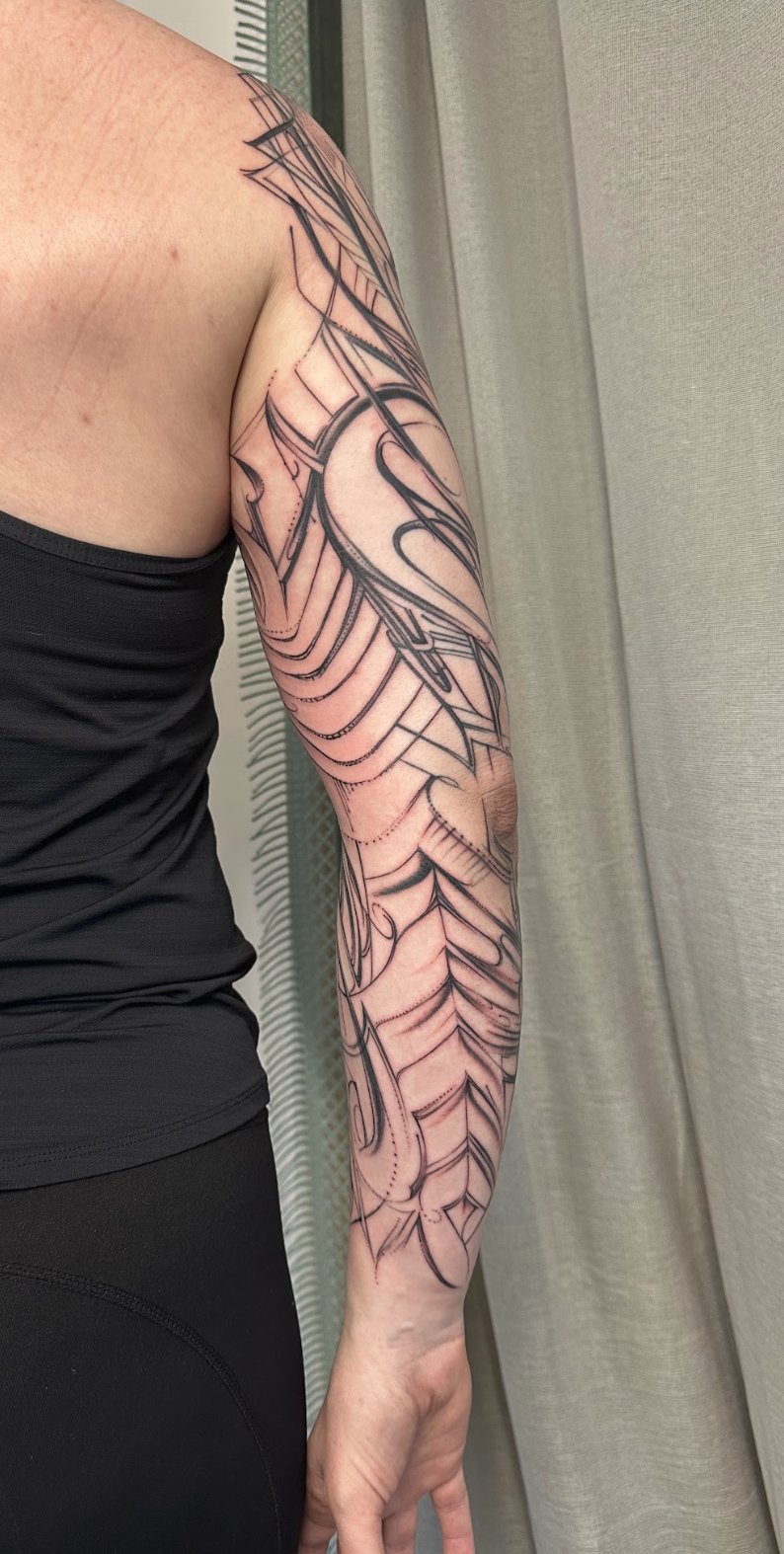 Geometric Chevron & Intricate Abstract Arm Flow Tattoo by Justine Almaraz