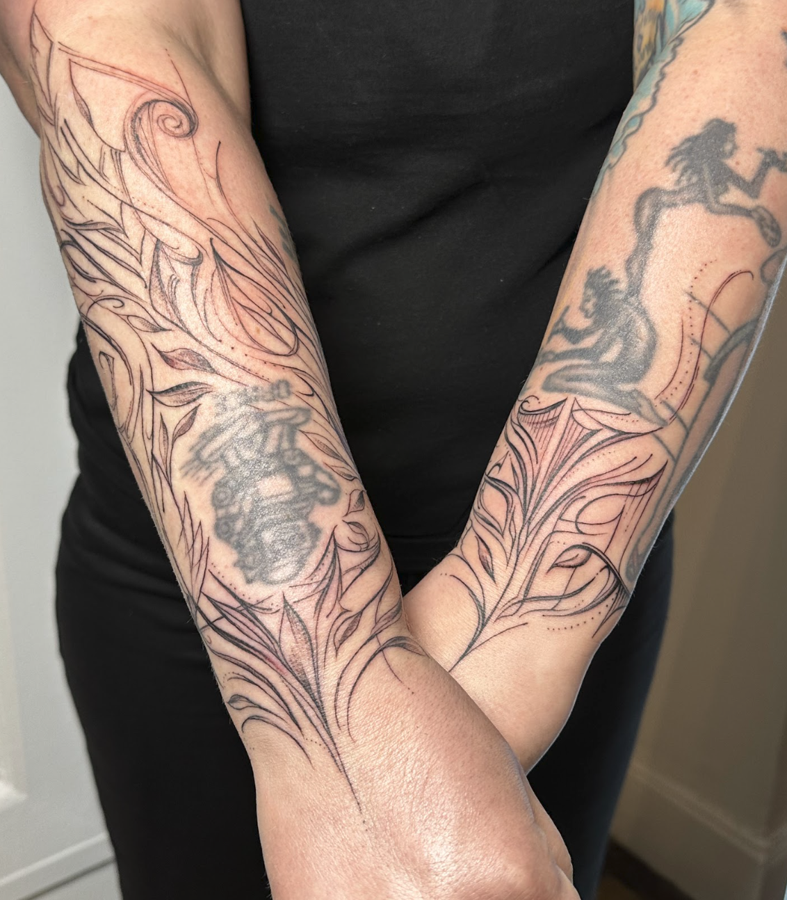 Symmetrical Botanical Feather & Ornamental Forearm Cuff Tattoo by Justine Almaraz