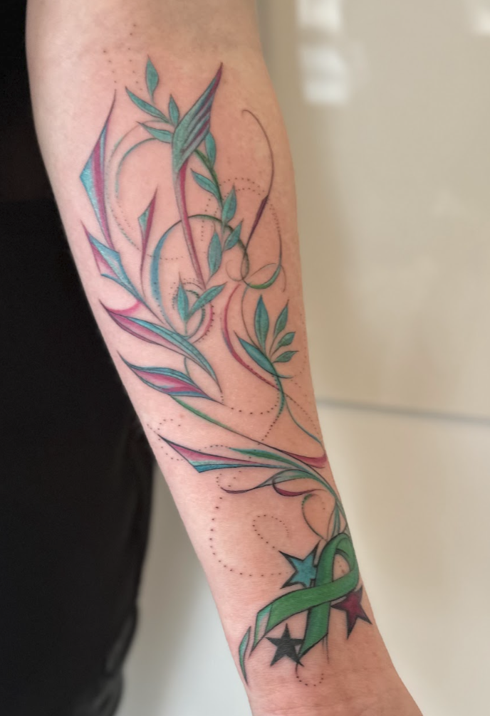 Memorial Ribbon & Sacred Botanical Starlight Forearm Tattoo by Justine Almaraz