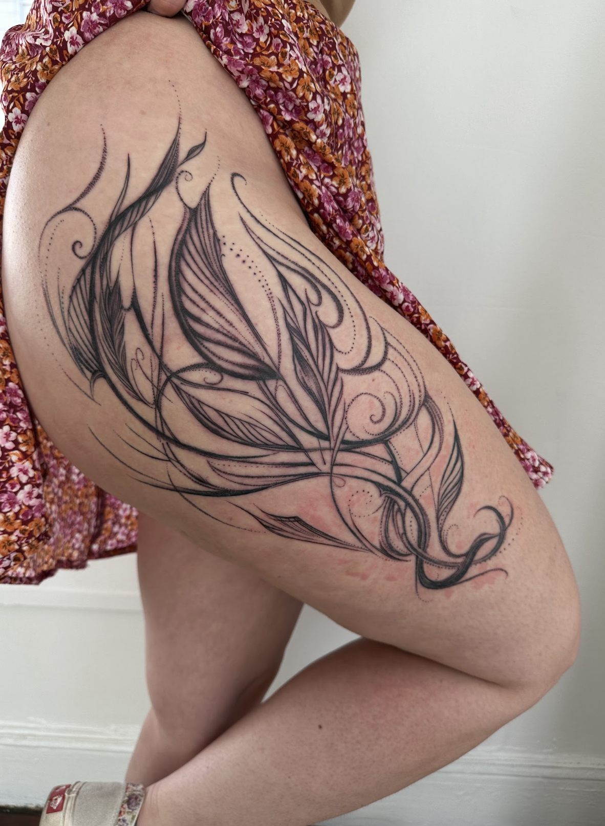 Dynamic Abstract Feather & Kinetic Wing Thigh Flourish Tattoo by Justine Almaraz