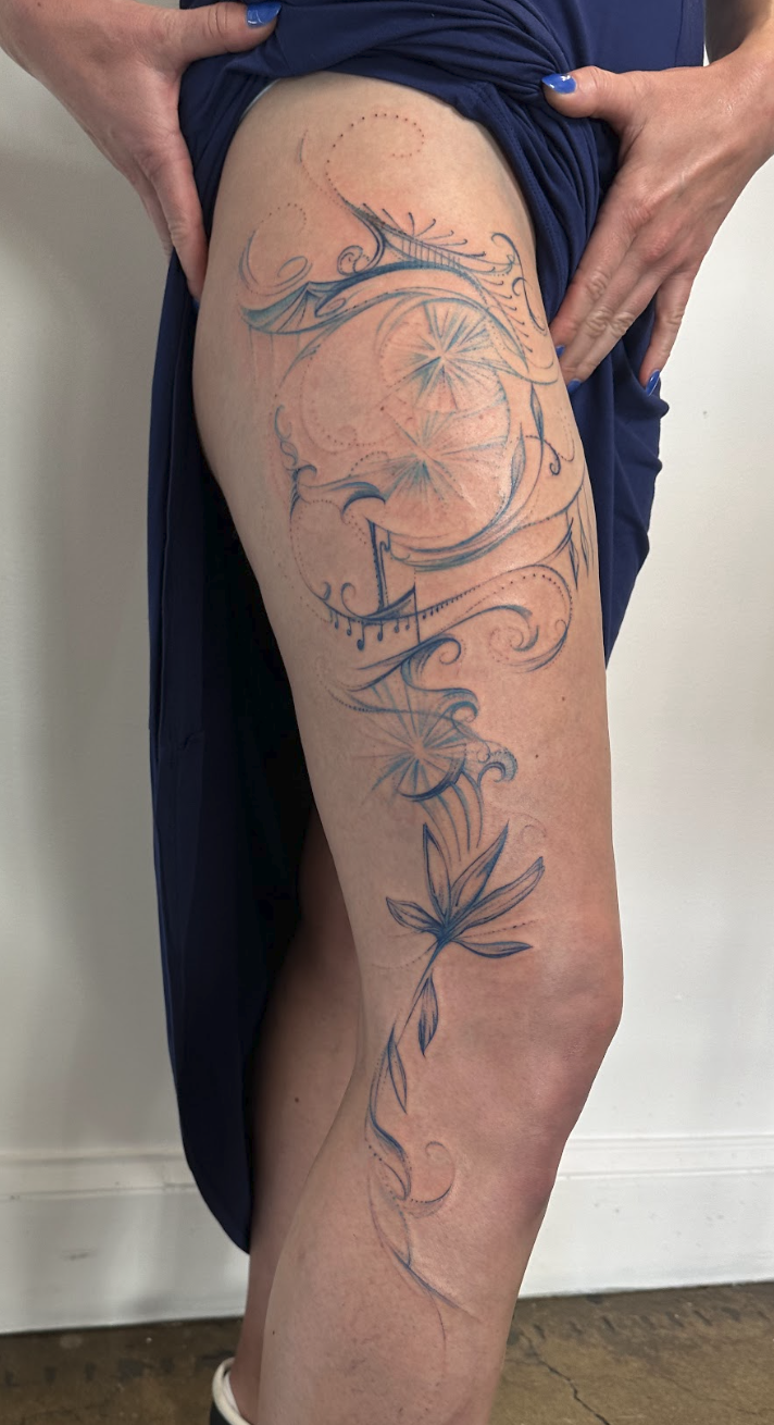 Radiant Starburst & Sacred Lotus Thigh Flourish Tattoo by Justine Almaraz