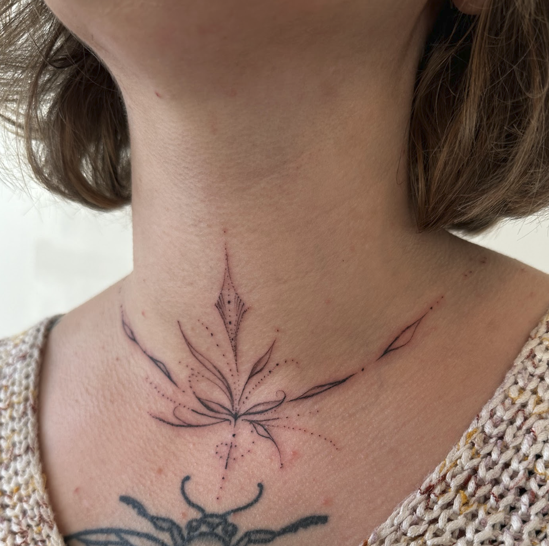 Sacred Ornamental Throat & Collarbone Resonant Lotus Tattoo by Justine Almaraz