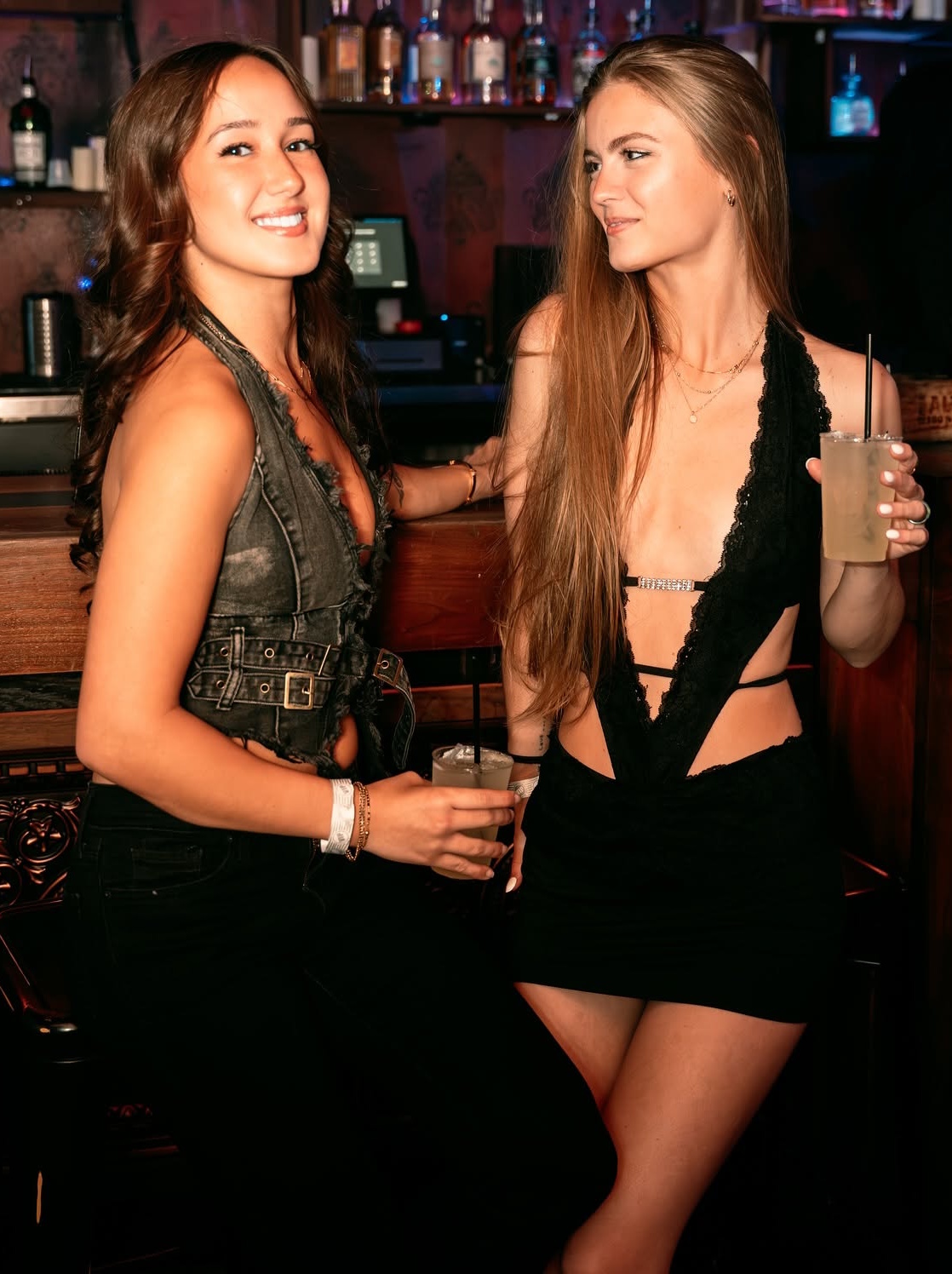 Guests enjoying cocktails at the bar at McQueens