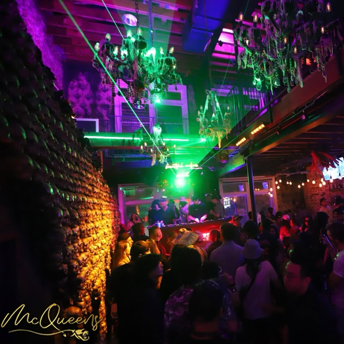 Packed Nightlife and Glowing Chandeliers at McQueens Social Lounge