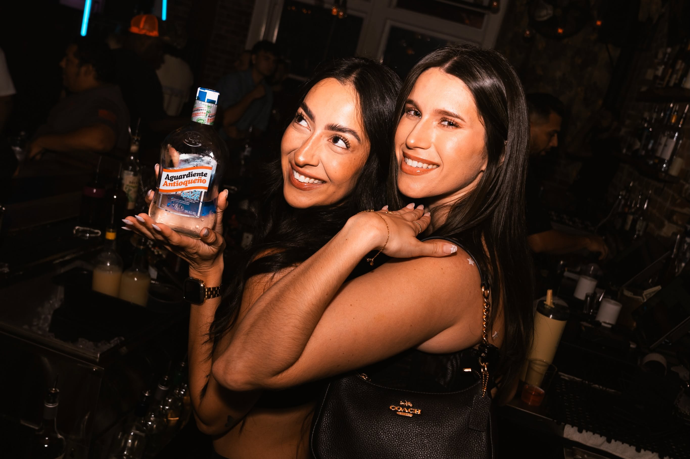 VIP Hosts celebrating with Aguardiente at McQueens