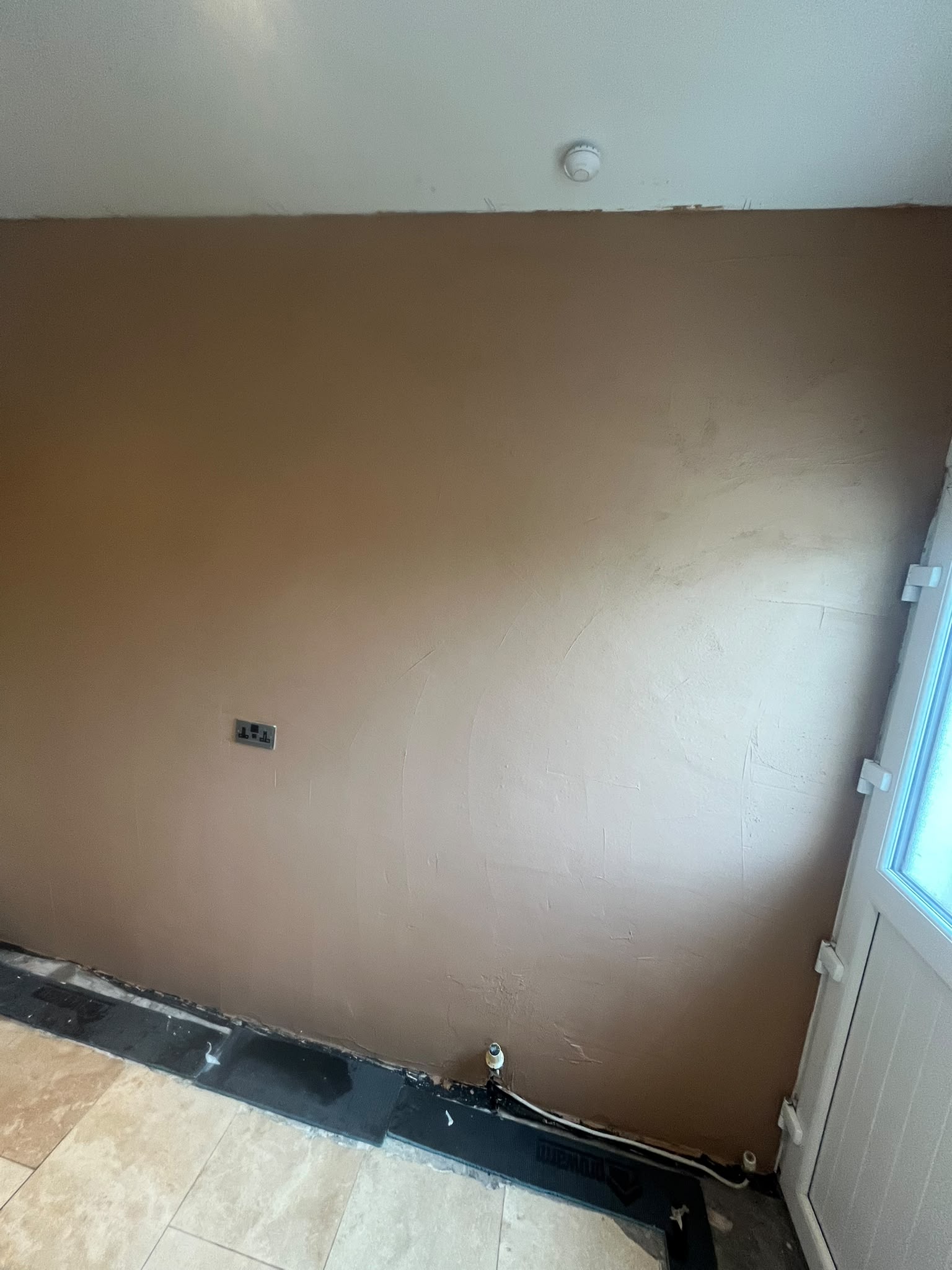 Re-plastering after damp proof course treatment
