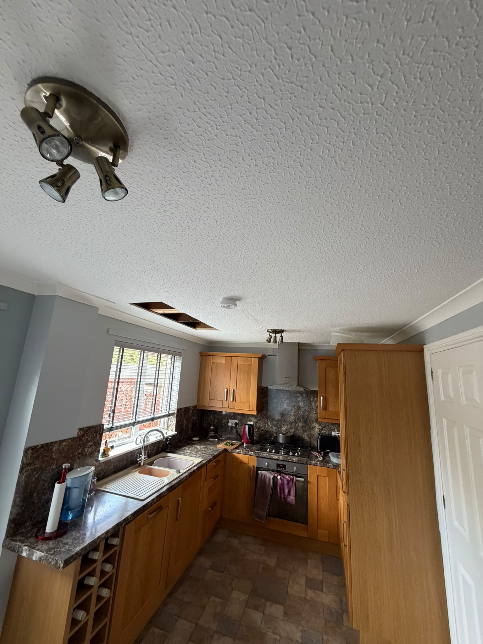 Ceiling water leak inspection and opening