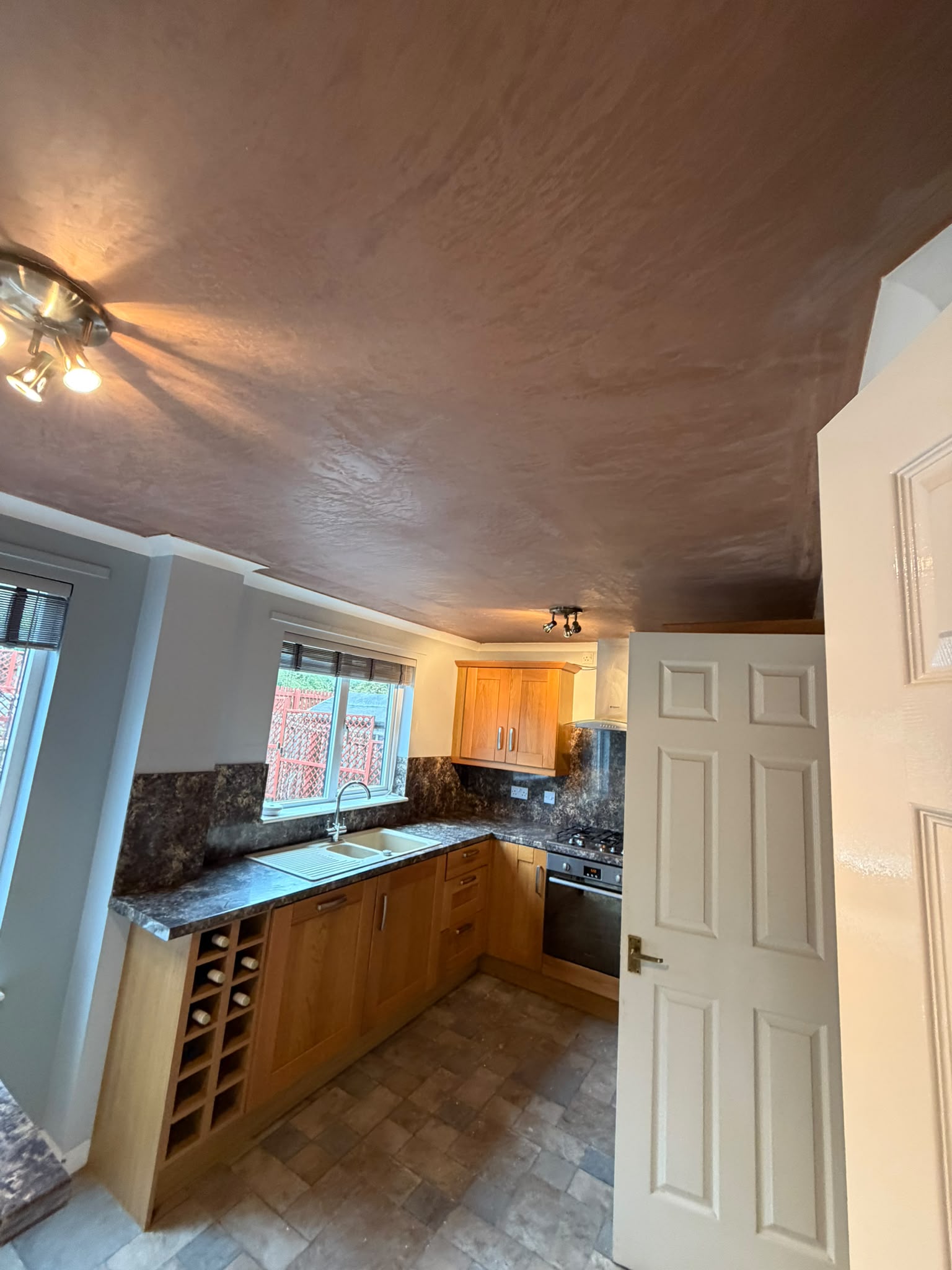 Freshly plastered kitchen ceiling after leak repair