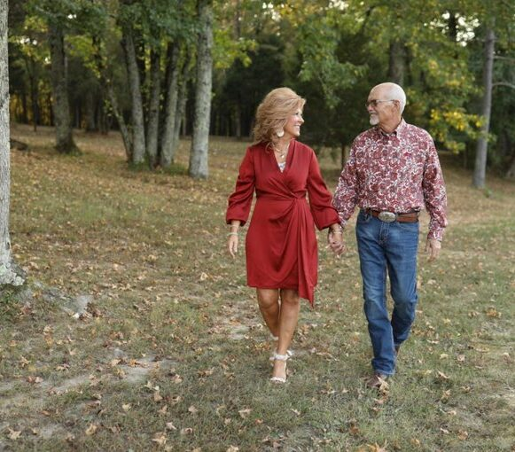 Gus & Judy Biggers walking hand in hand