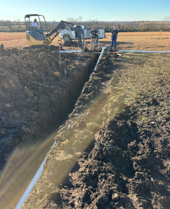 Dylan Busey & Co Excavation crew trenching a sewer line in Northeast Kansas