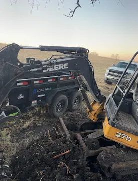Debris removal brush and roots loaded into dump trailer, Dylan Busey & Co Excavation