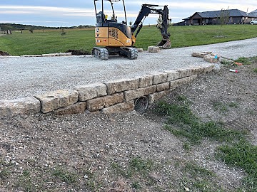 Limestone wall headwall around driveway culvert, Dylan Busey & Co Excavation