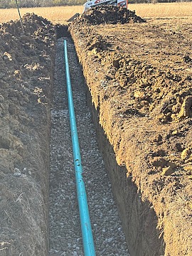 Trenching water line rock bedding, Dylan Busey & Co Excavation