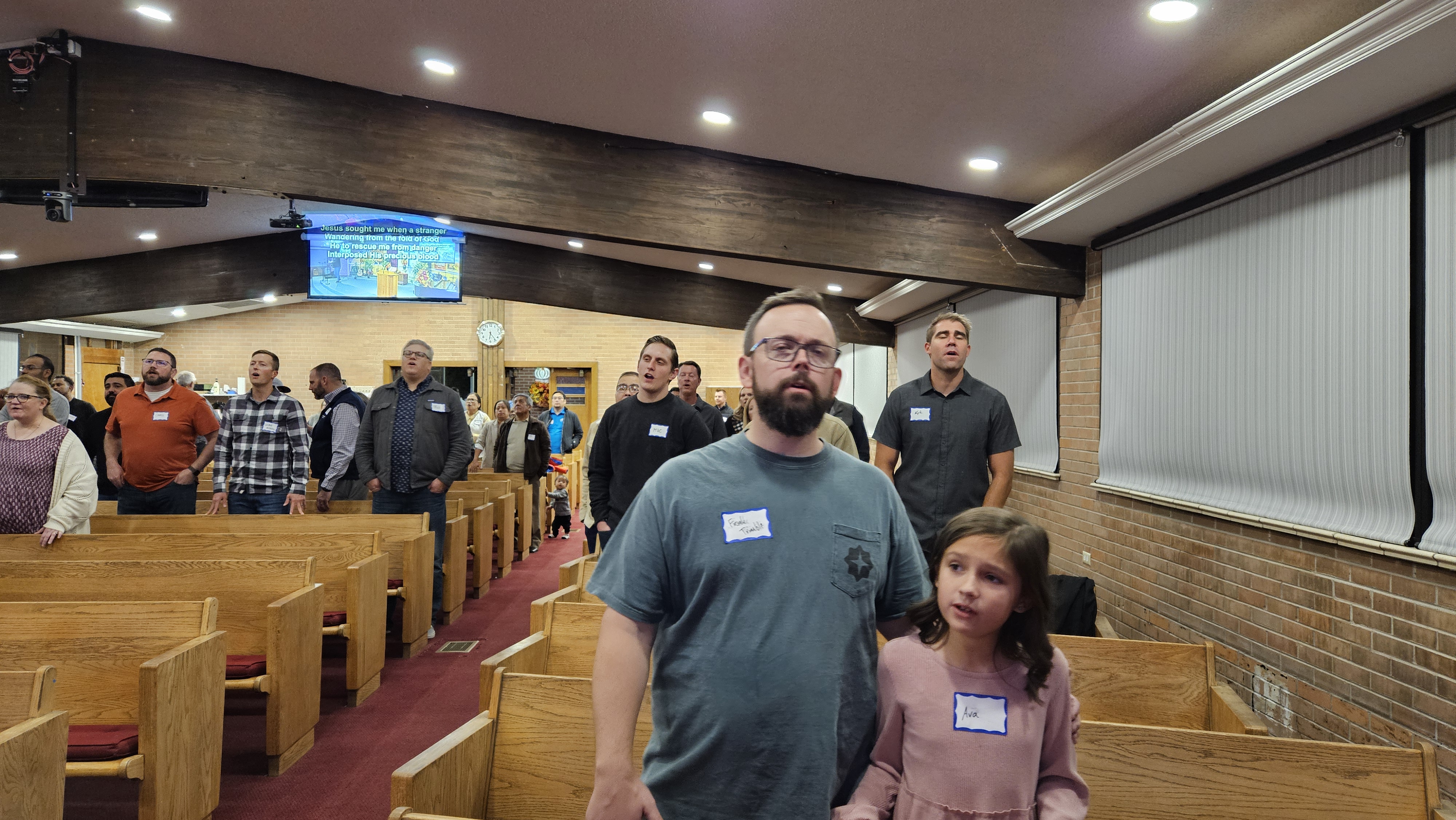 Congregation singing in praise at Annual Meeting