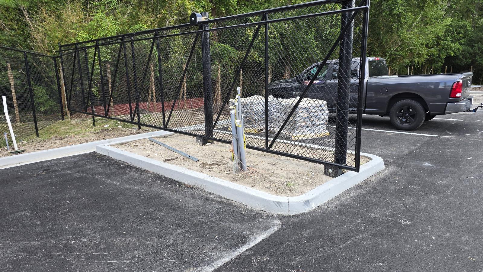 Commercial sliding cantilever gate by Bella Fence