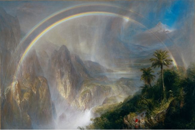 Double rainbow arching over ethereal misty mountain valley and radiant cascades