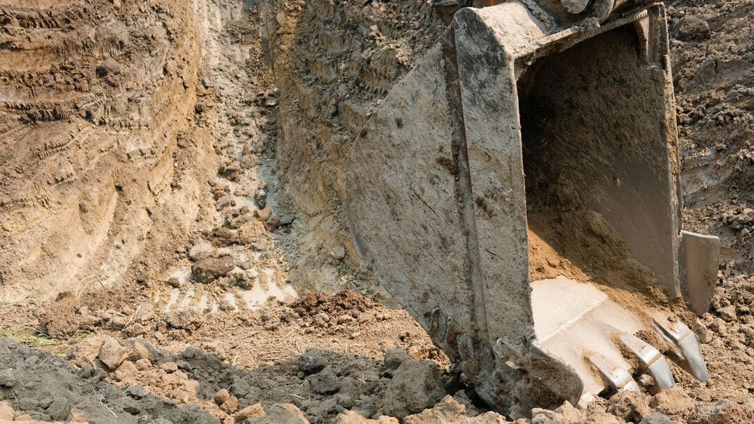 What happens to the soil and spoil after earthmoving?