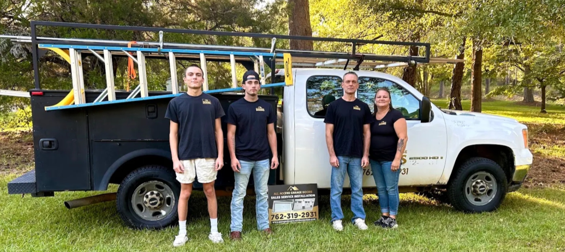 All Access Garage Doors family and team standing beside their official service work truck