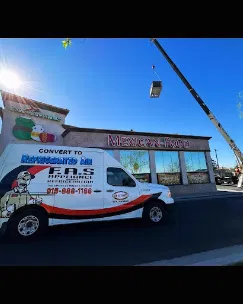 F.A.S branded service van and rooftop crane installing air conditioning unit at commercial Mexican restaurant in El Paso