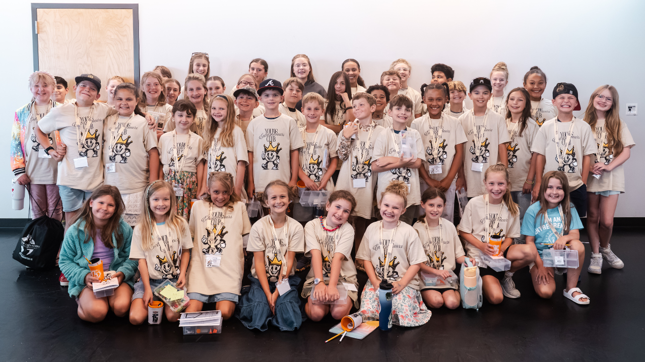 Young Entrepreneurs Club members gathered wearing their club shirts, equipped and ready to build