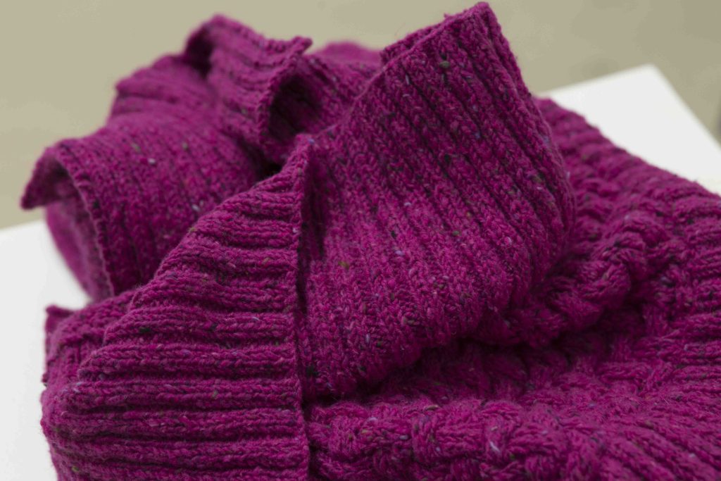 KOCO Knitting artisans working collaboratively with bamboo needles